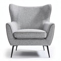Grey upholstered accent chair with wingback design and metal legs